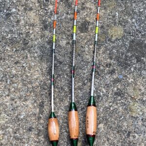 A set of three traditional style crow quill bodied antenna floats.