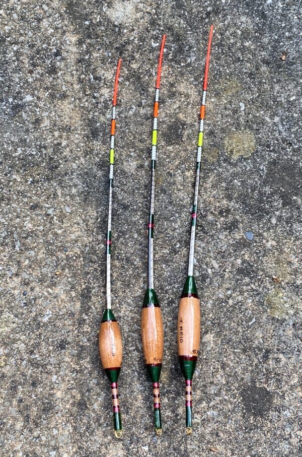 A set of three traditional style crow quill bodied antenna floats.