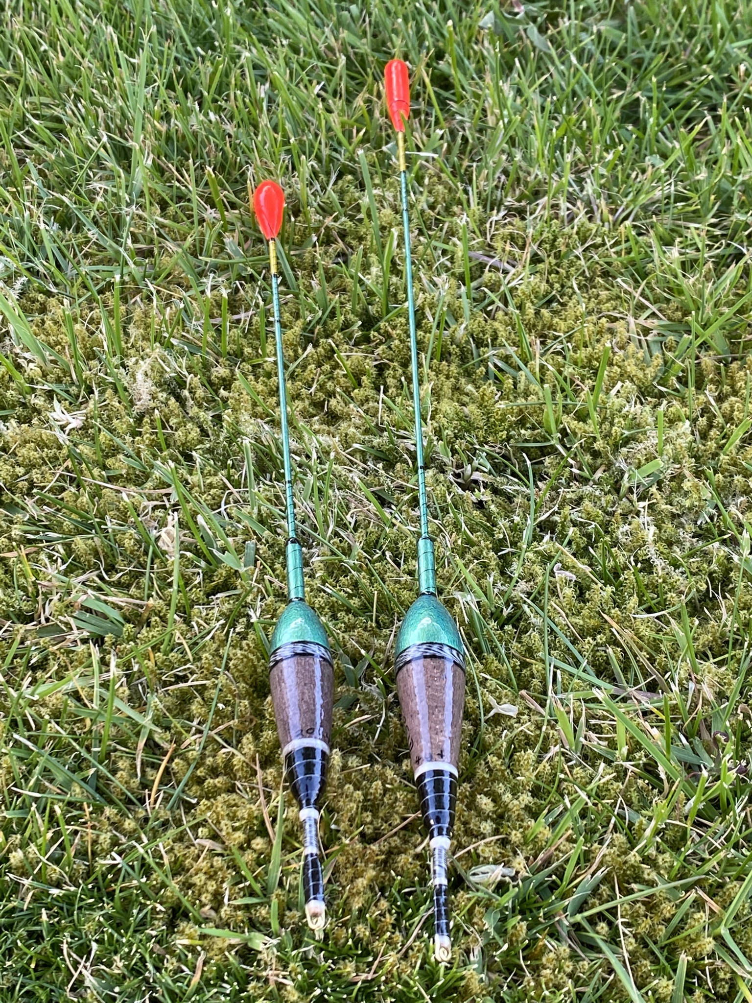 A pair of traditional style carbon stem drift beater floats.